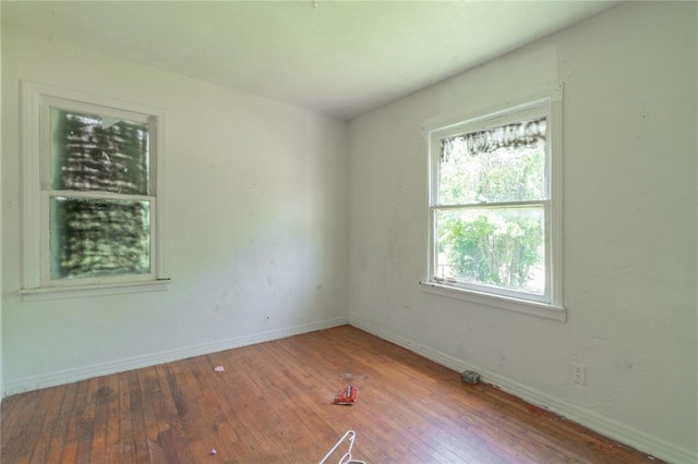 3917 SE 12th St, Oklahoma City, OK 73115 - unfurnished room featuring hardwood / wood-style flooring and baseboards