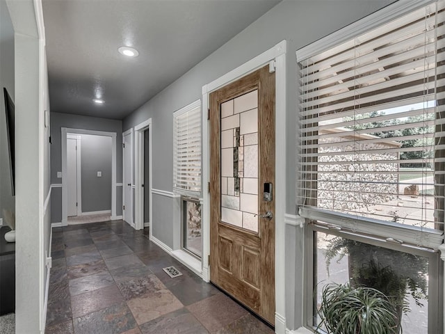 5101 Long Branch Ln, Edmond, OK 73034 - doorway with recessed lighting and stone finish flooring