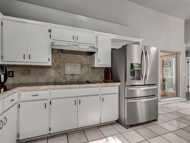 5101 Long Branch Ln, Edmond, OK 73034 - kitchen with stainless steel fridge with ice dispenser, under cabinet range hood, black electric cooktop, and tasteful backsplash