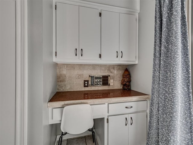 5101 Long Branch Ln, Edmond, OK 73034 - tiled office featuring built in study area