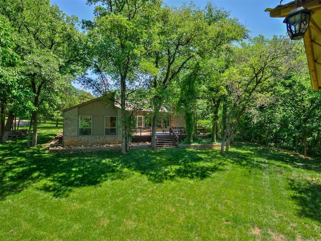5101 Long Branch Ln, Edmond, OK 73034 - view of grassy yard featuring a wooden deck