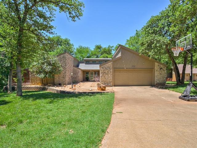 5101 Long Branch Ln, Edmond, OK 73034 - mid-century home with stone siding, driveway, a garage, and a front lawn