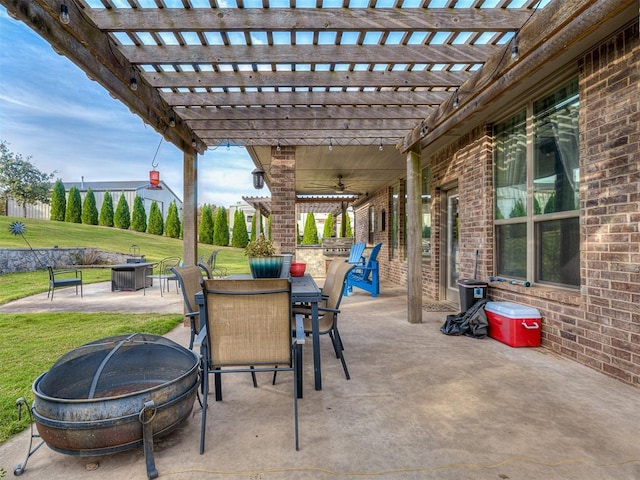 5608 Courtland Ln, Choctaw, OK 73020 - view of patio with an outdoor fire pit, outdoor dining space, a pergola, and a ceiling fan