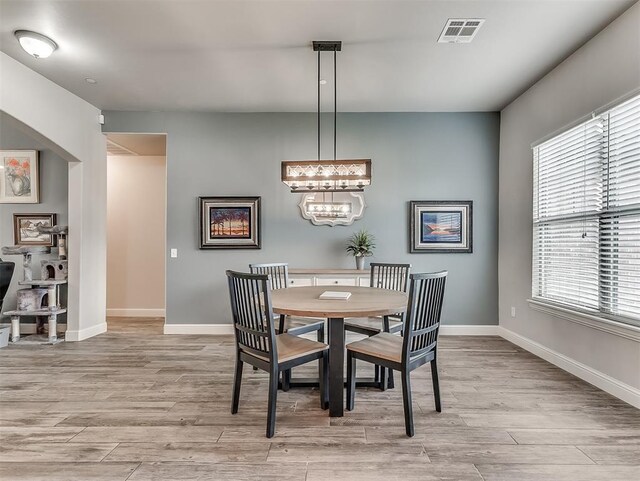 5608 Courtland Ln, Choctaw, OK 73020 - dining space featuring light wood-style floors, plenty of natural light, and baseboards