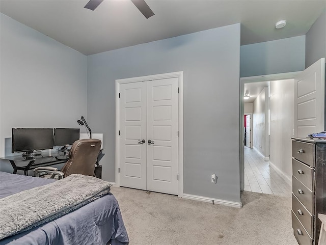 5608 Courtland Ln, Choctaw, OK 73020 - bedroom with light carpet, baseboards, a closet, an office area, and a ceiling fan