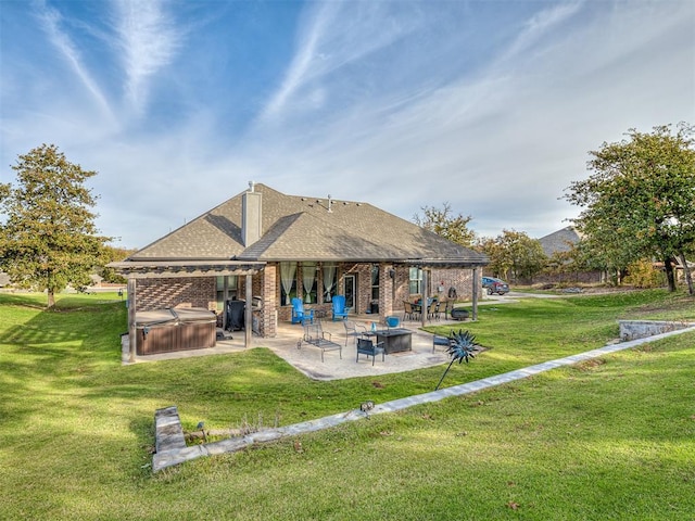 5608 Courtland Ln, Choctaw, OK 73020 - rear view of property with a hot tub, a patio, brick siding, and a yard