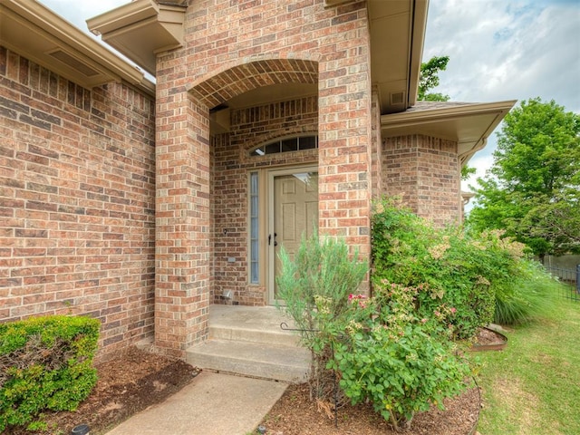 4033 NE 138th St, Edmond, OK 73013 - view of exterior entry featuring brick siding