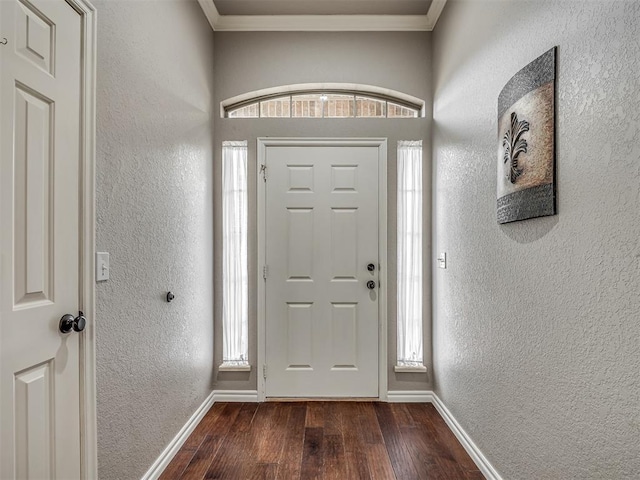 4033 NE 138th St, Edmond, OK 73013 - foyer featuring dark wood-type flooring, baseboards, a textured wall, and crown molding