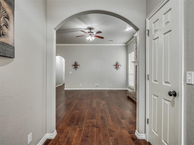 4033 NE 138th St, Edmond, OK 73013 - hall with arched walkways, ornamental molding, dark wood-style flooring, baseboards, and a textured wall