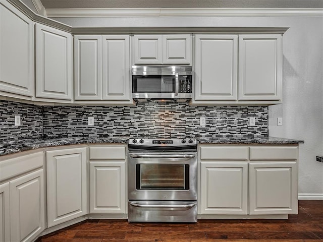 4033 NE 138th St, Edmond, OK 73013 - kitchen featuring stainless steel appliances, tasteful backsplash, dark wood-type flooring, and white cabinets