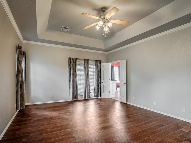 4033 NE 138th St, Edmond, OK 73013 - empty room featuring a tray ceiling, ceiling fan, hardwood / wood-style flooring, baseboards, and ornamental molding