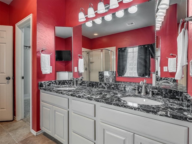 4033 NE 138th St, Edmond, OK 73013 - full bathroom featuring a shower stall, double vanity, and tile patterned floors