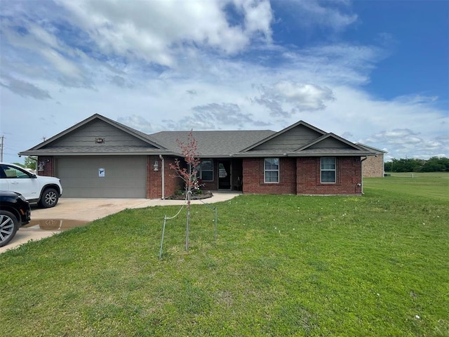 103 Thurman Dr, Walters, OK 73572 - ranch-style home featuring a garage, concrete driveway, brick siding, and a front lawn