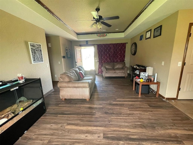103 Thurman Dr, Walters, OK 73572 - living room with wood finished floors, a raised ceiling, ceiling fan, baseboards, and a textured ceiling