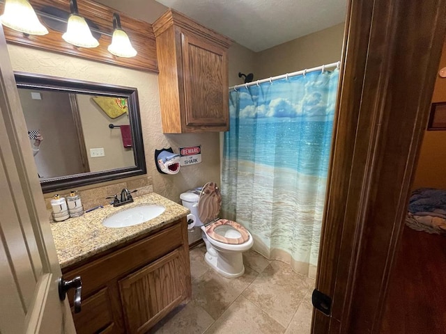 103 Thurman Dr, Walters, OK 73572 - full bathroom featuring toilet, vanity, tile patterned floors, a shower with shower curtain, and a textured wall