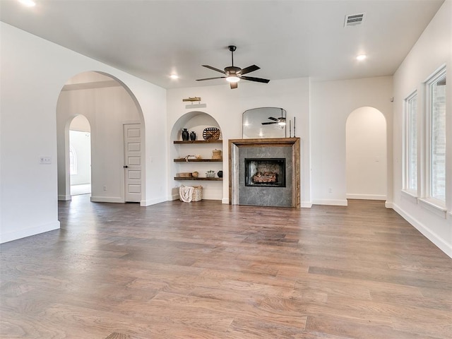 9316 NW 84th St, Yukon, OK 73099 - unfurnished living room featuring ceiling fan, a fireplace, wood finished floors, recessed lighting, and baseboards