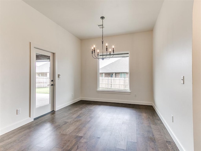 9316 NW 84th St, Yukon, OK 73099 - empty room with a chandelier, dark wood-style flooring, and baseboards
