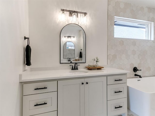 9316 NW 84th St, Yukon, OK 73099 - full bathroom featuring a freestanding bath, vanity, and plenty of natural light