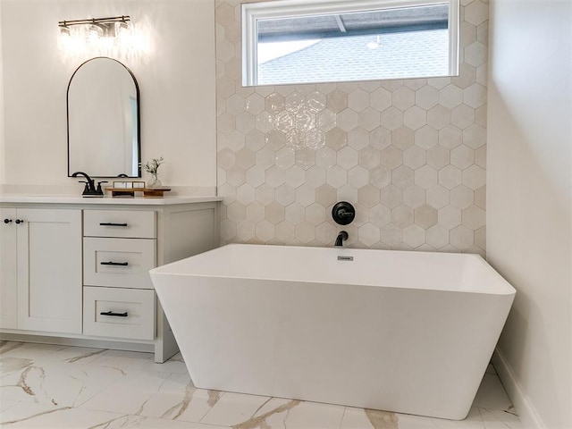 9316 NW 84th St, Yukon, OK 73099 - bathroom with marble look tile flooring, a soaking tub, and healthy amount of natural light