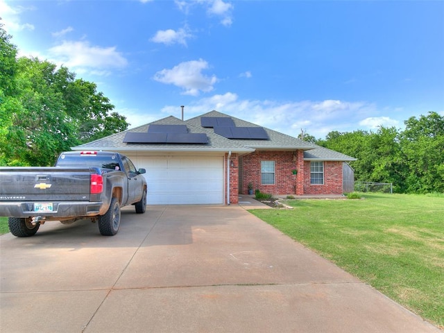 409 NW Jefferson Ave, Piedmont, OK 73078 - single story home with a shingled roof, a garage, roof mounted solar panels, and driveway