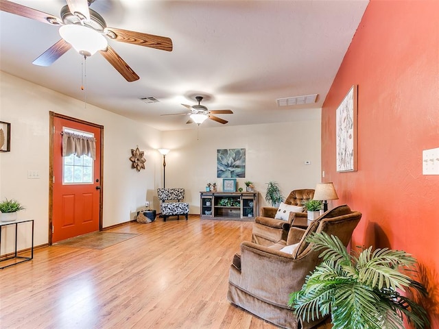 409 NW Jefferson Ave, Piedmont, OK 73078 - living area with a ceiling fan, light wood-style flooring, and baseboards