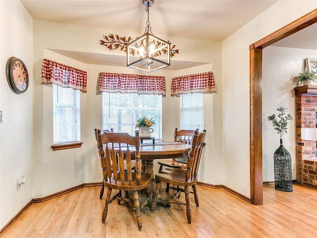 409 NW Jefferson Ave, Piedmont, OK 73078 - dining room with a chandelier, wood finished floors, and baseboards