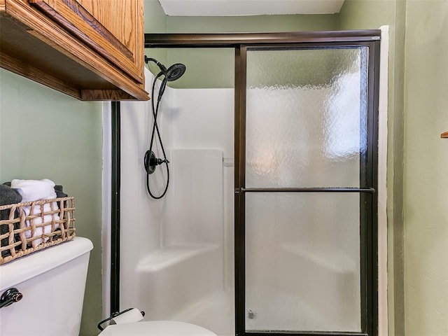 409 NW Jefferson Ave, Piedmont, OK 73078 - full bathroom featuring toilet and a stall shower
