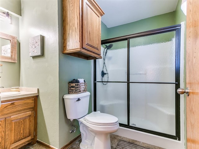 409 NW Jefferson Ave, Piedmont, OK 73078 - full bathroom with vanity, a stall shower, toilet, and baseboards