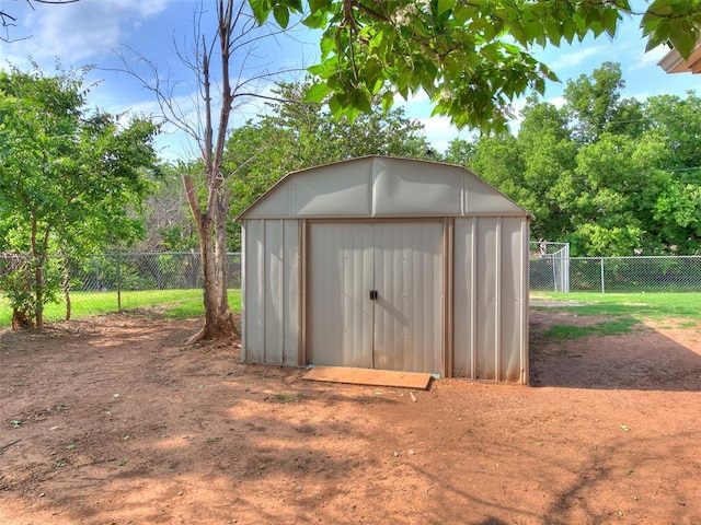 409 NW Jefferson Ave, Piedmont, OK 73078 - view of shed featuring a fenced backyard and view of scattered trees