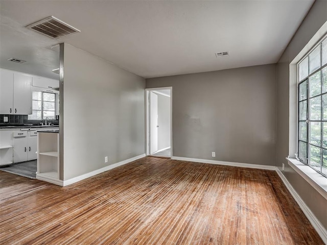 4109 N Sterling Ave, Oklahoma City, OK 73122 - unfurnished living room featuring wood finished floors