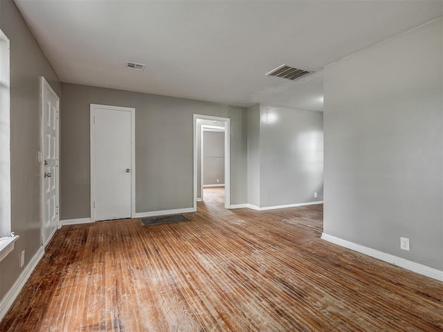 4109 N Sterling Ave, Oklahoma City, OK 73122 - unfurnished room featuring hardwood / wood-style floors and baseboards