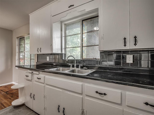 4109 N Sterling Ave, Oklahoma City, OK 73122 - kitchen with white cabinetry and backsplash