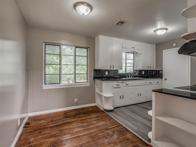 4109 N Sterling Ave, Oklahoma City, OK 73122 - kitchen featuring open shelves, dark countertops, dark wood-style flooring, and white cabinets