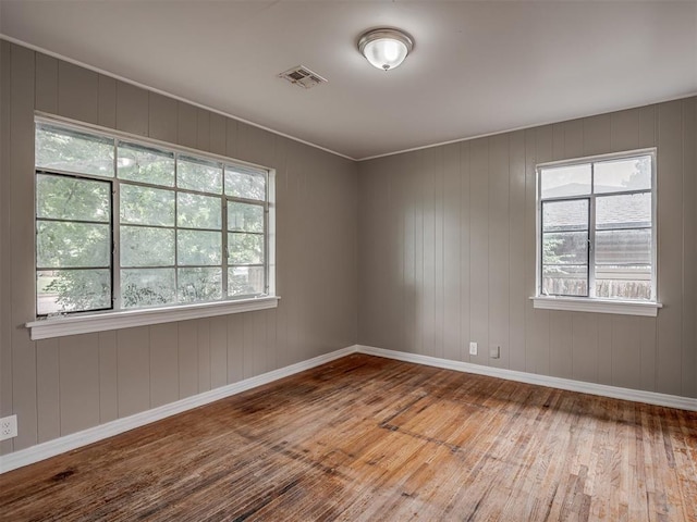 4109 N Sterling Ave, Oklahoma City, OK 73122 - spare room featuring hardwood / wood-style floors and healthy amount of natural light