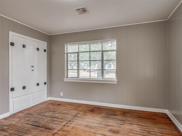 4109 N Sterling Ave, Oklahoma City, OK 73122 - unfurnished bedroom featuring wood finished floors and ornamental molding