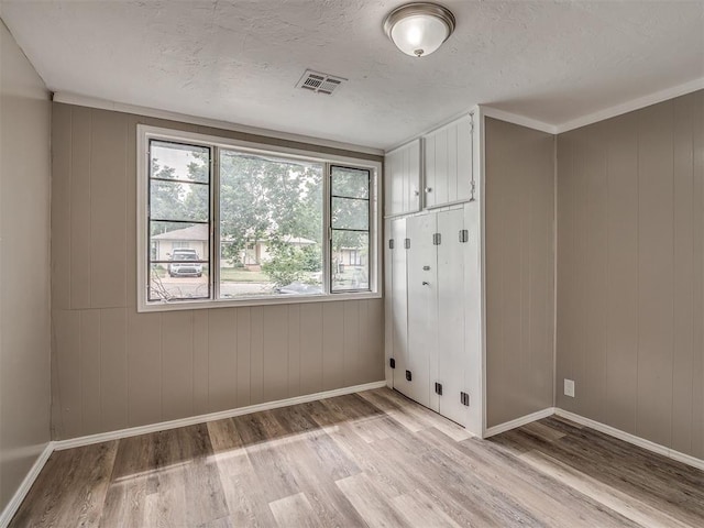 4109 N Sterling Ave, Oklahoma City, OK 73122 - empty room with light wood finished floors and a textured ceiling