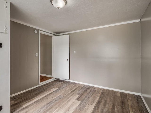 4109 N Sterling Ave, Oklahoma City, OK 73122 - empty room with wood finished floors and crown molding