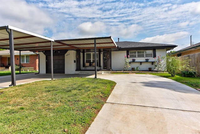 2805 SW 54th Pl, Oklahoma City, OK 73119 - ranch-style home featuring brick siding, an attached carport, concrete driveway, and a garage