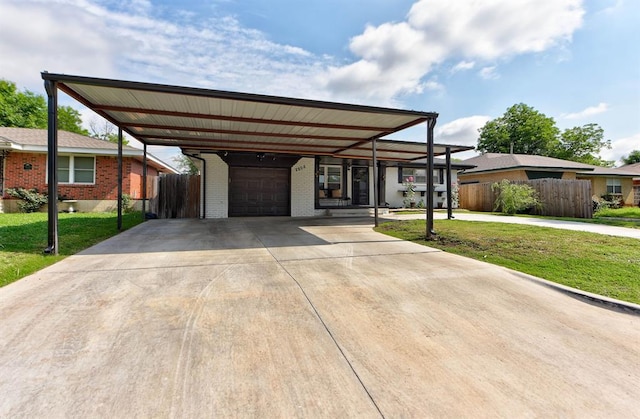 2805 SW 54th Pl, Oklahoma City, OK 73119 - view of front of house featuring brick siding, a carport, a garage, and driveway