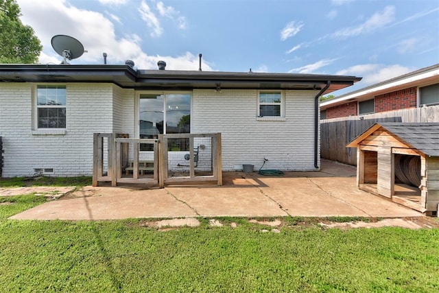2805 SW 54th Pl, Oklahoma City, OK 73119 - back of property featuring brick siding and a patio area