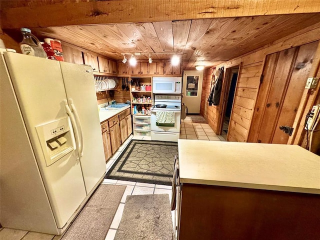 36578 Ns 3500th St, Konawa, OK 74849 - kitchen featuring white appliances, wood ceiling, light tile patterned floors, wooden walls, and light countertops