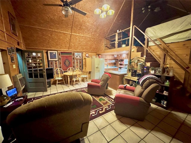 36578 Ns 3500th St, Konawa, OK 74849 - living area featuring a ceiling fan, tile patterned floors, wooden walls, and high vaulted ceiling