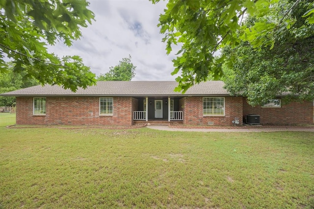 325 S Pine St, Crescent, OK 73028 - single story home featuring cooling unit, brick siding, a porch, and a front yard