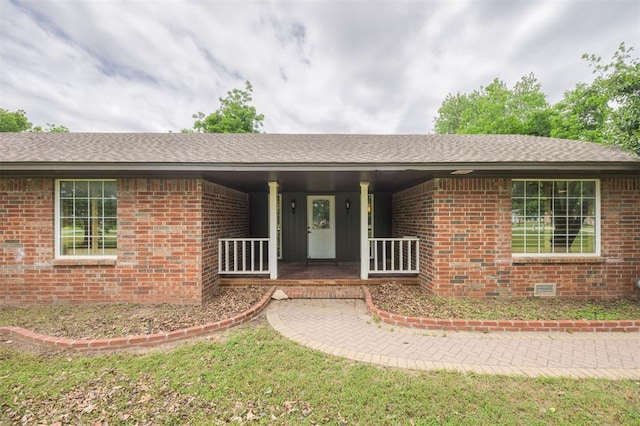 325 S Pine St, Crescent, OK 73028 - ranch-style home featuring brick siding, a porch, and roof with shingles