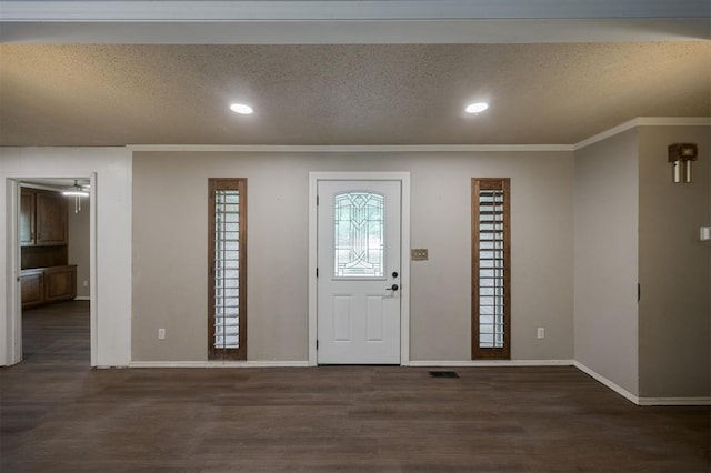 325 S Pine St, Crescent, OK 73028 - foyer entrance featuring wood finished floors, recessed lighting, baseboards, ornamental molding, and a textured ceiling