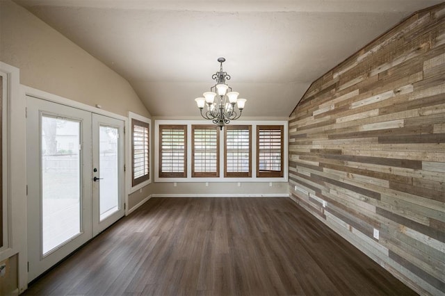 325 S Pine St, Crescent, OK 73028 - unfurnished dining area with lofted ceiling, a chandelier, french doors, dark wood-type flooring, and wood walls