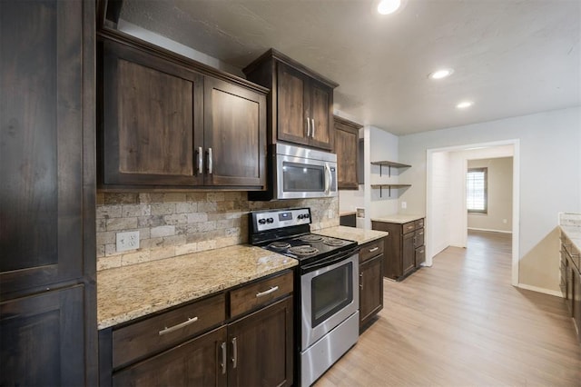325 S Pine St, Crescent, OK 73028 - kitchen featuring stainless steel appliances, open shelves, tasteful backsplash, dark brown cabinets, and light wood-type flooring