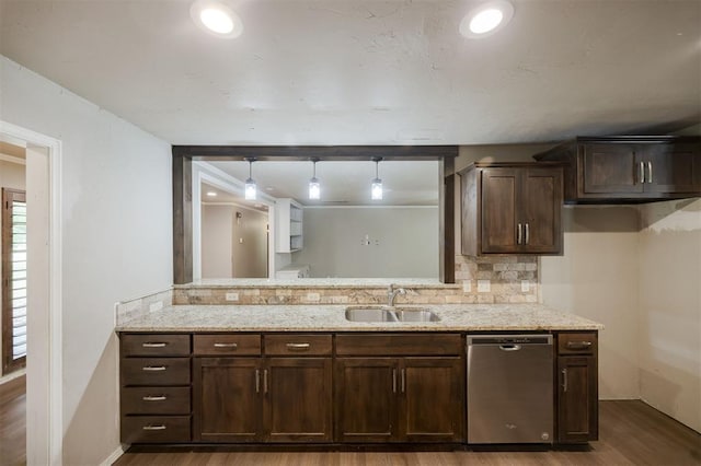 325 S Pine St, Crescent, OK 73028 - kitchen featuring stainless steel dishwasher, a sink, dark wood-style flooring, backsplash, and dark brown cabinets