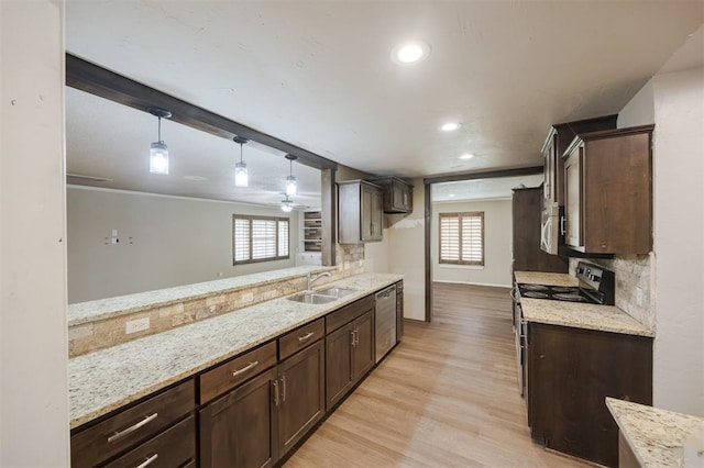 325 S Pine St, Crescent, OK 73028 - kitchen with appliances with stainless steel finishes, a sink, light wood-type flooring, dark brown cabinets, and recessed lighting