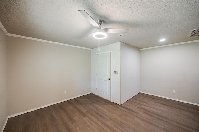 325 S Pine St, Crescent, OK 73028 - unfurnished room featuring wood finished floors, a ceiling fan, a textured ceiling, baseboards, and crown molding
